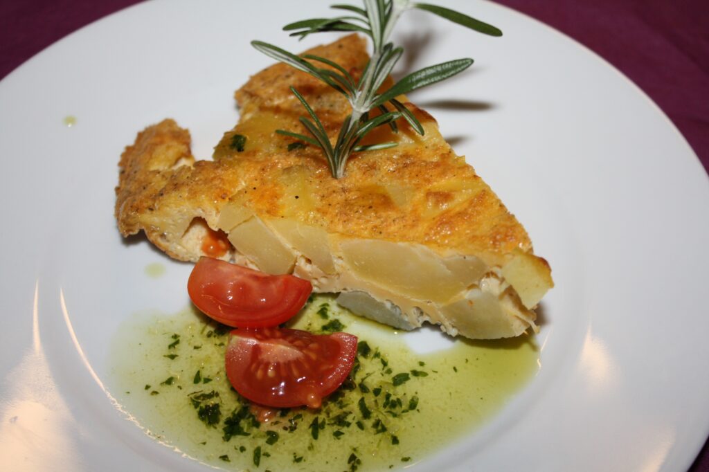 Serve it with a drizzle of extra virgin olive oil on top, a small piece of fresh tomato on the side, and a sprig of rosemary to add aroma and a Mediterranean touch.