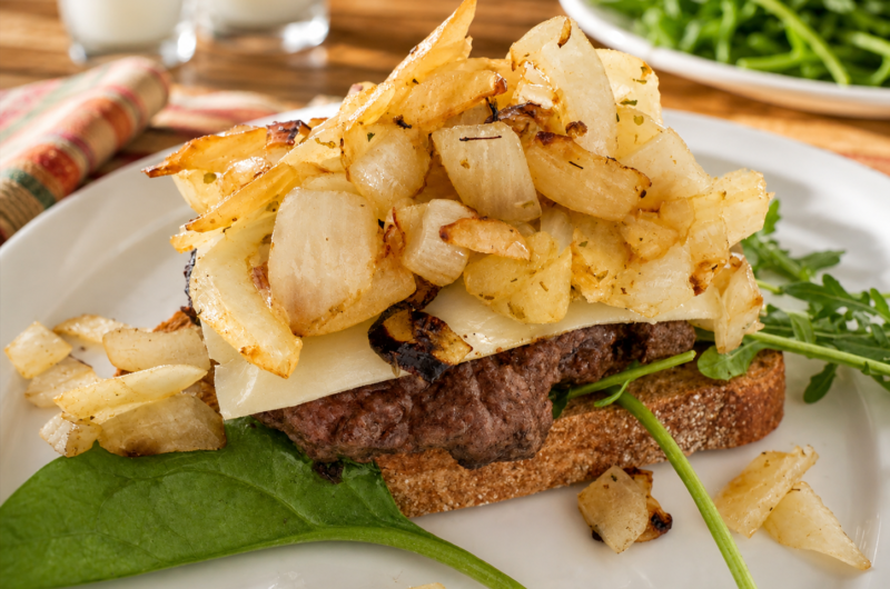 Bison Burger with Caramelized Onions, Swiss Cheese & Arugula