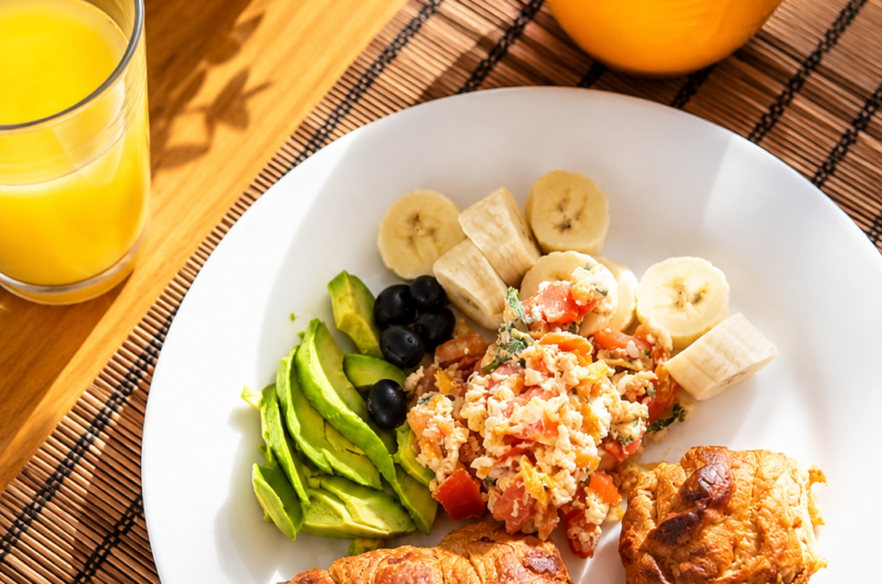 Rucu de la Pachamama Breakfast – Avocado Croissant with Tomato Eggs & Fresh Fruit