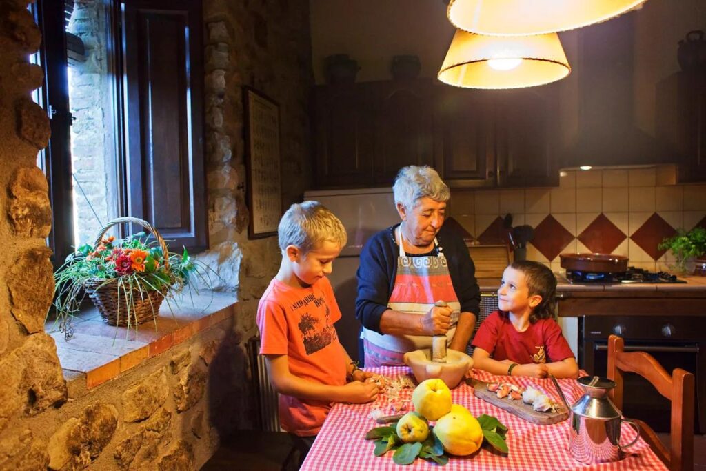 Spanish family cooking together in a real home kitchen